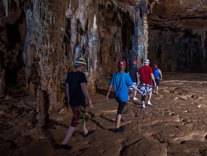 group exploring atm cave