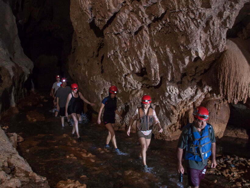group walking in atm cave
